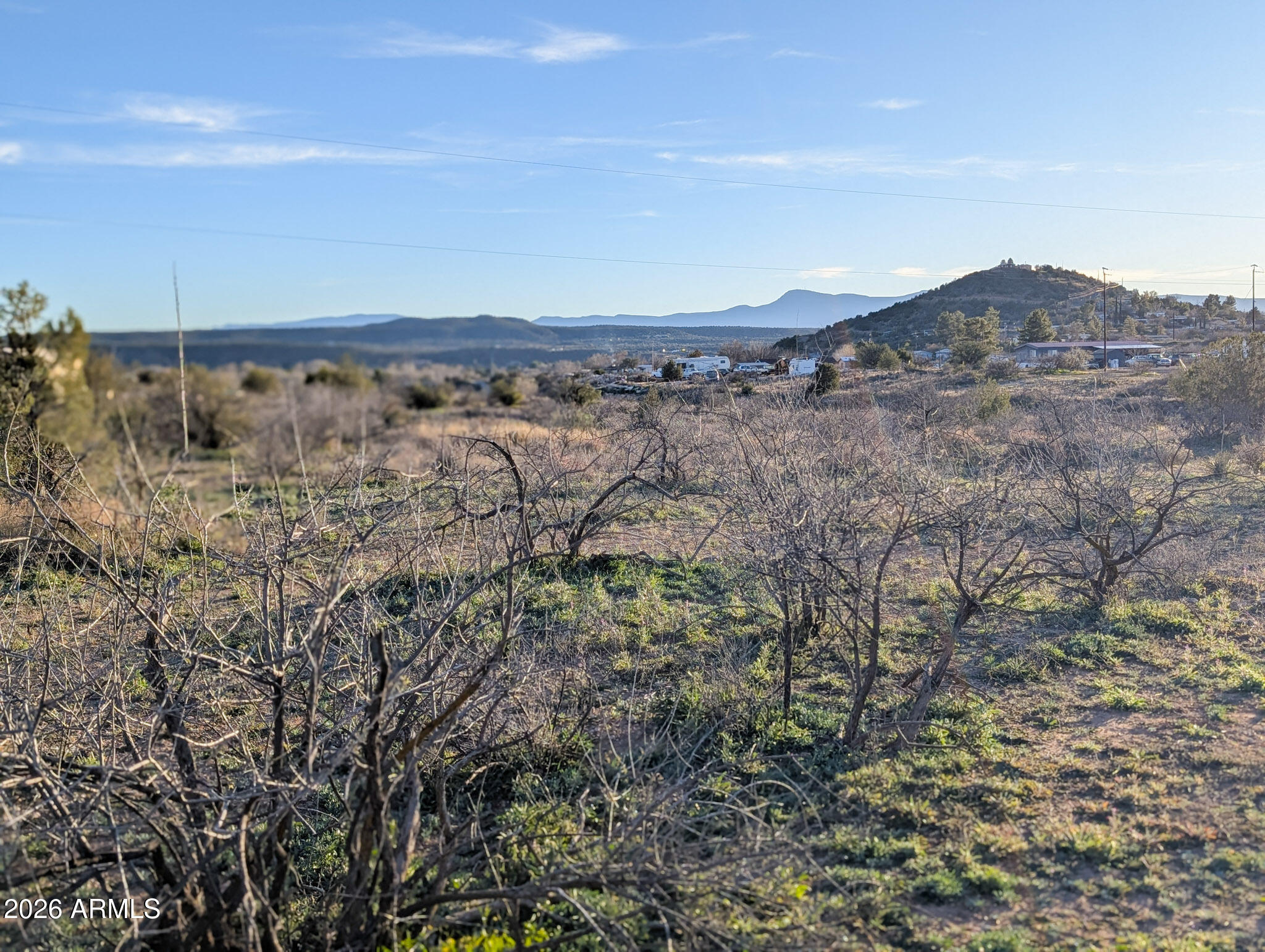 4025 East Red Baron Drive, Unit 40525757Z Rimrock, AZ 86335 - Photo 16 of 66 a view of a dry field with trees in background