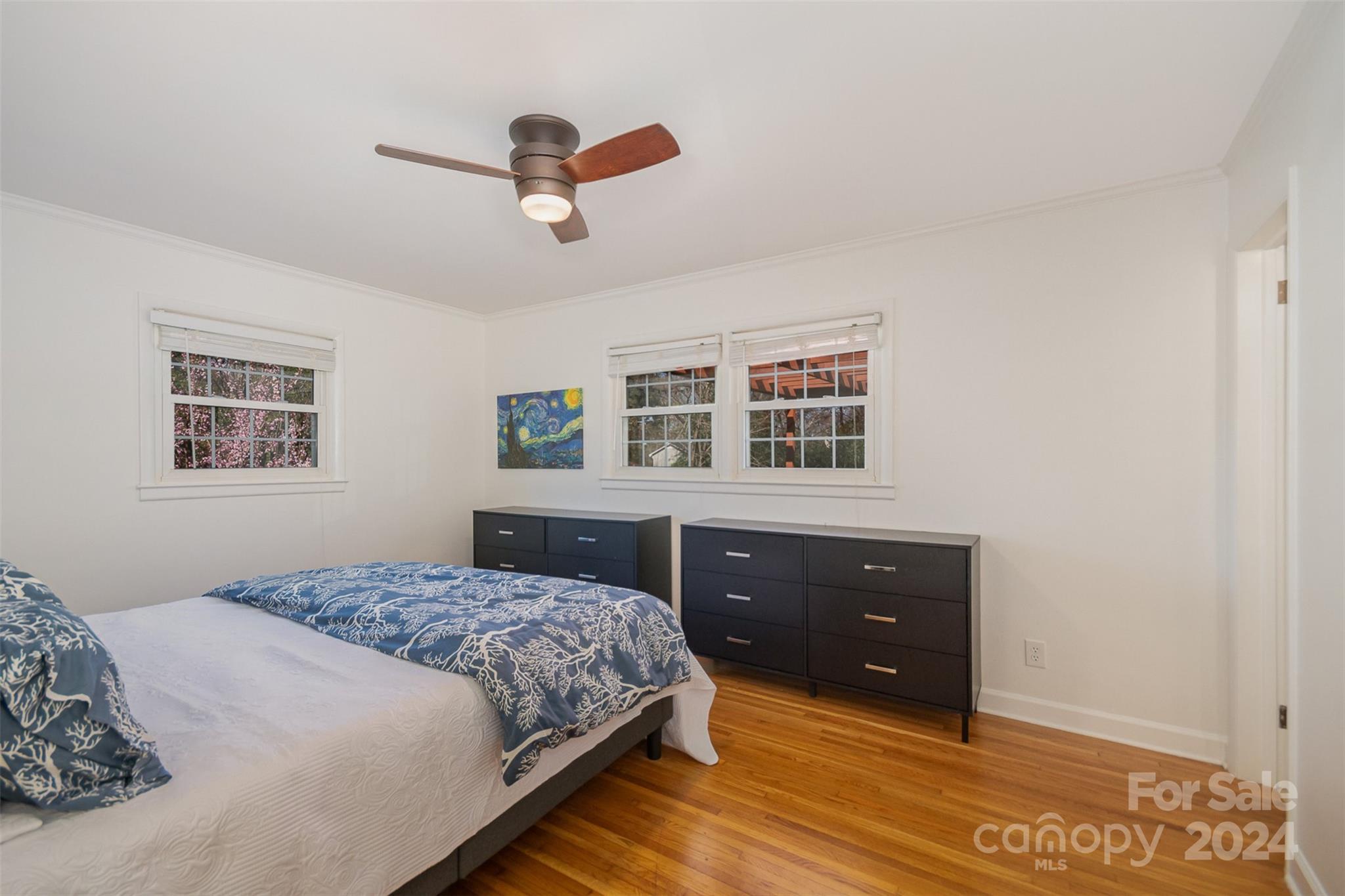 3901 Sulkirk Road Charlotte, NC 28210 - Photo 13 of 24 a bedroom with a bed and a dresser