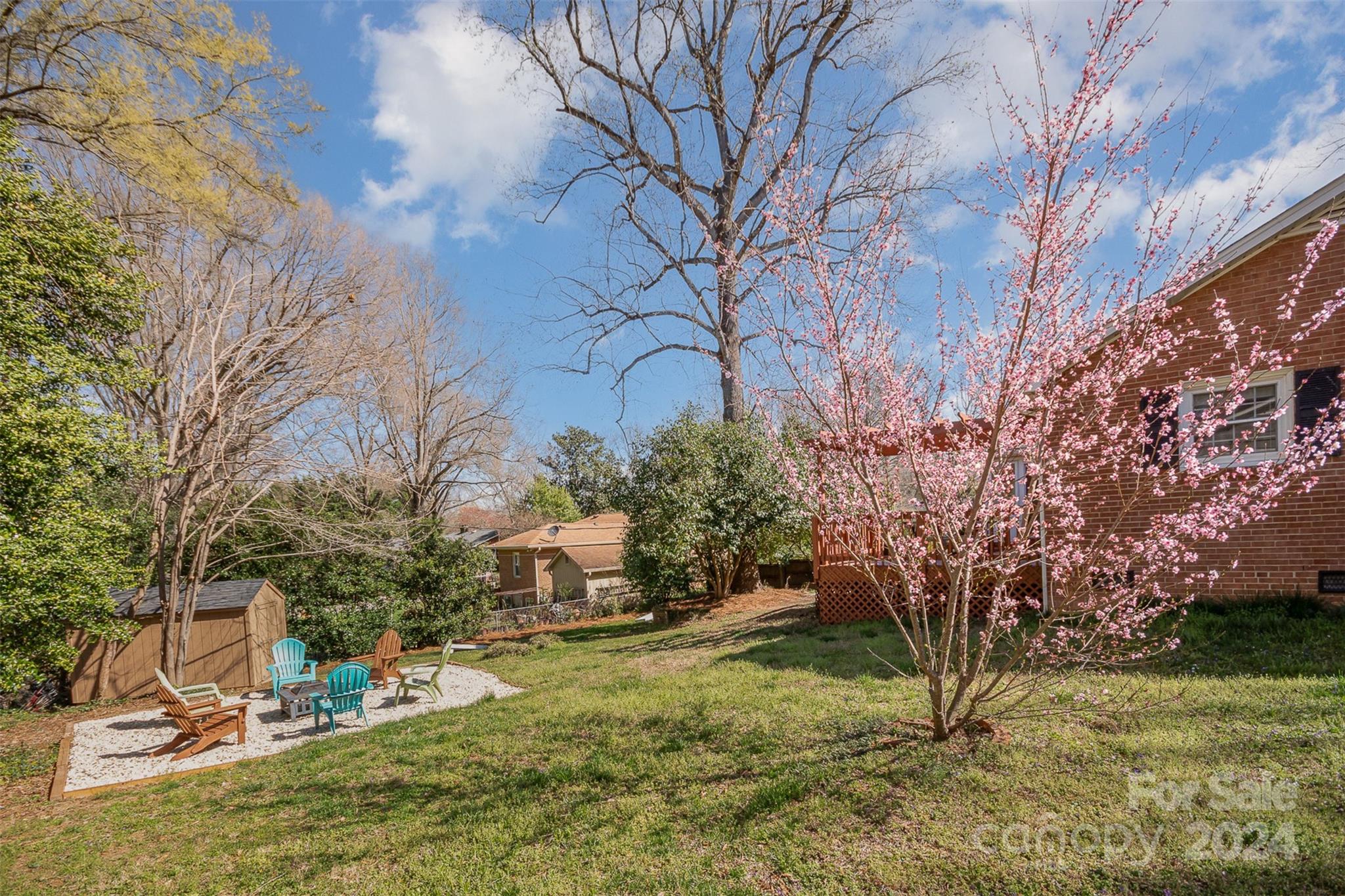 3901 Sulkirk Road Charlotte, NC 28210 - Photo 23 of 24 a view of backyard with wooden fence and large trees