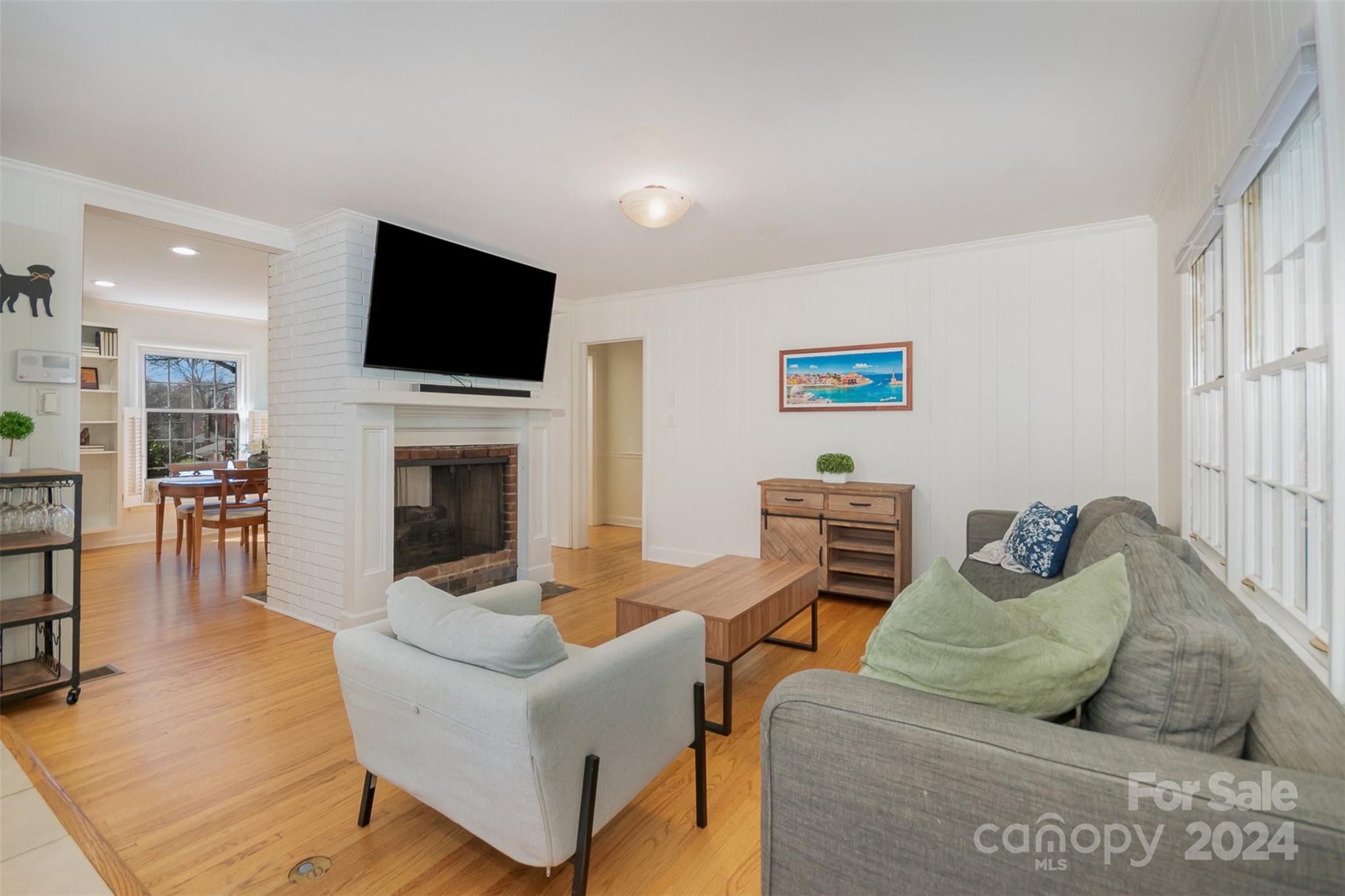 3901 Sulkirk Road Charlotte, NC 28210 - Photo 6 of 24 a living room with furniture and a flat screen tv