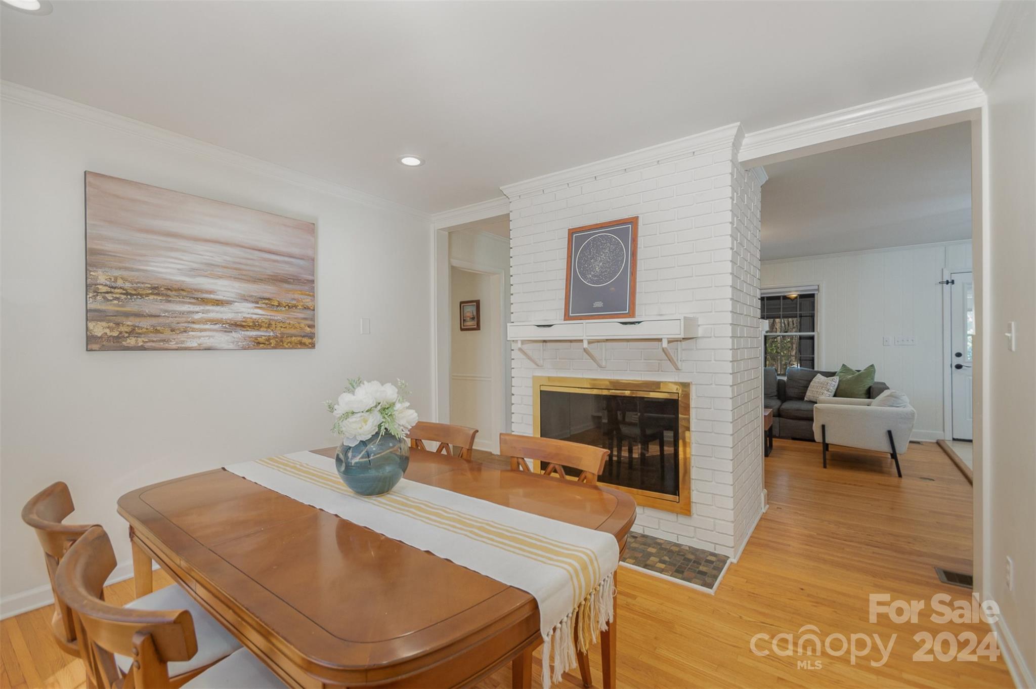 3901 Sulkirk Road Charlotte, NC 28210 - Photo 8 of 24 a living room with furniture dining table and a fireplace