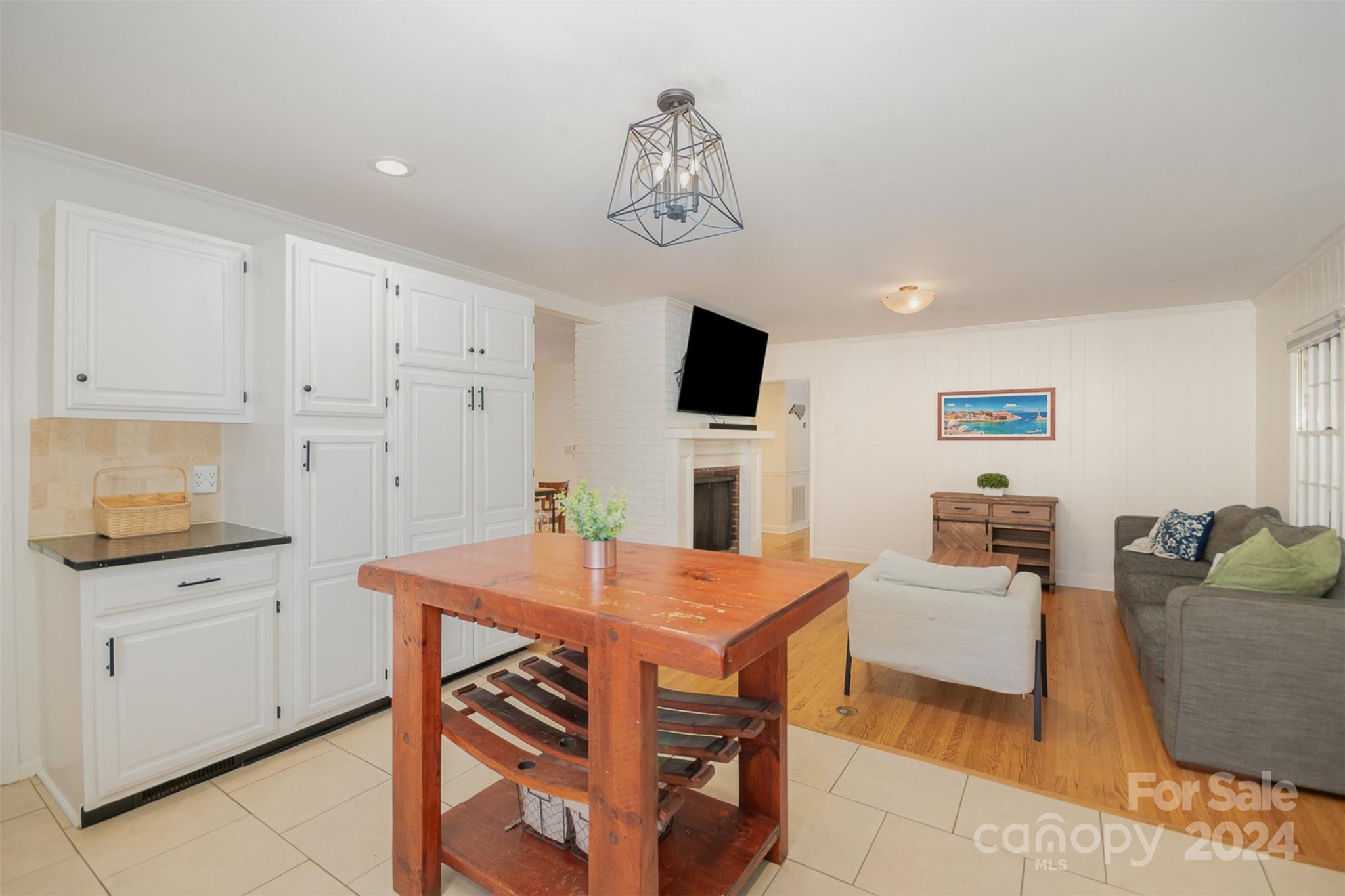 3901 Sulkirk Road Charlotte, NC 28210 - Photo 10 of 24 a view of a dining room with furniture and a chandelier