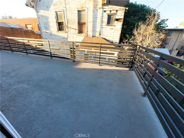 a view of a balcony with an outdoor space