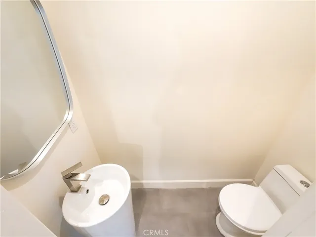a bathroom with a toilet and a sink