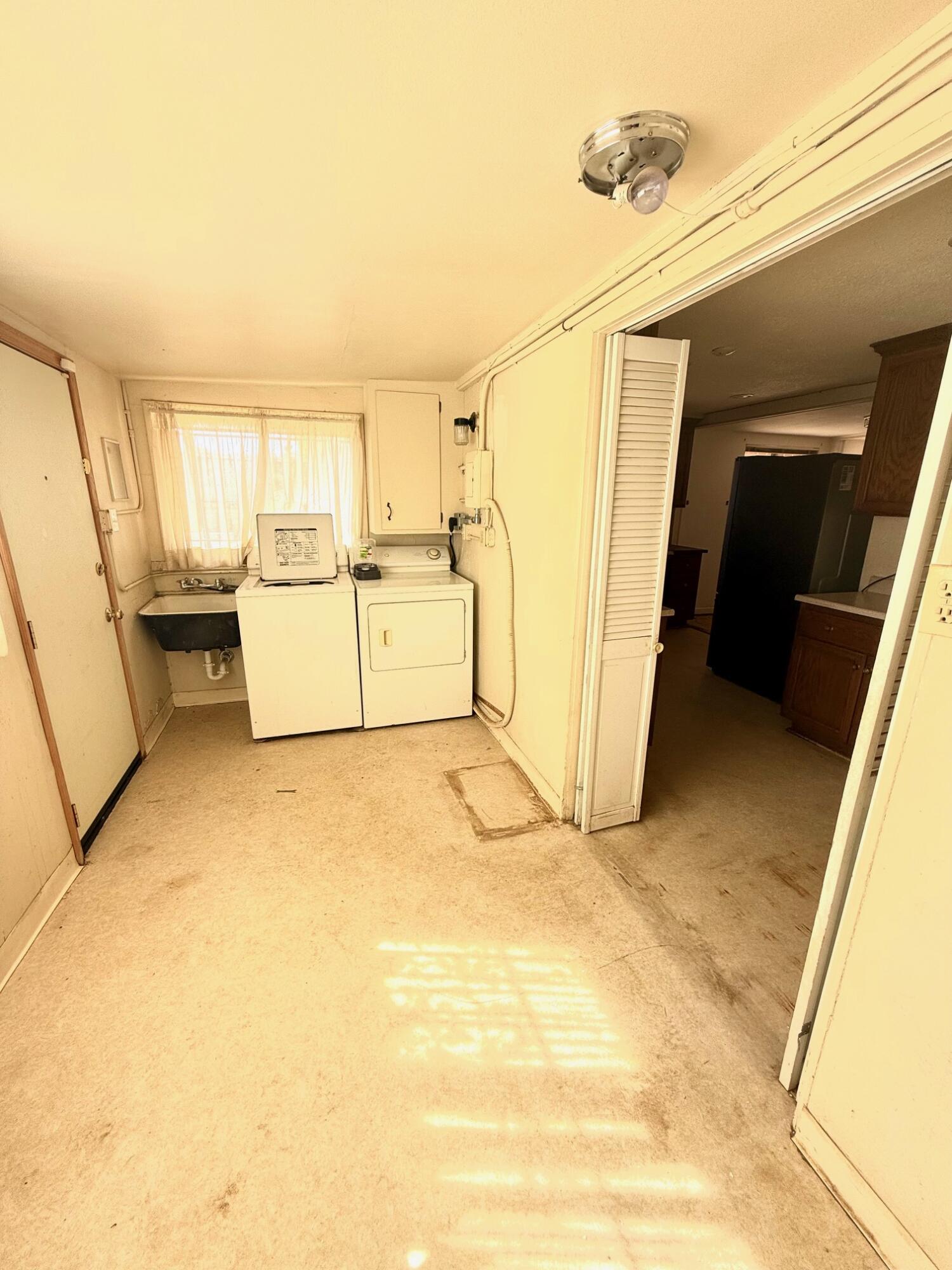7990 Ramas Avenue Yucca Valley, CA 92284 - Photo 11 of 19 a view of a kitchen with storage and utility
