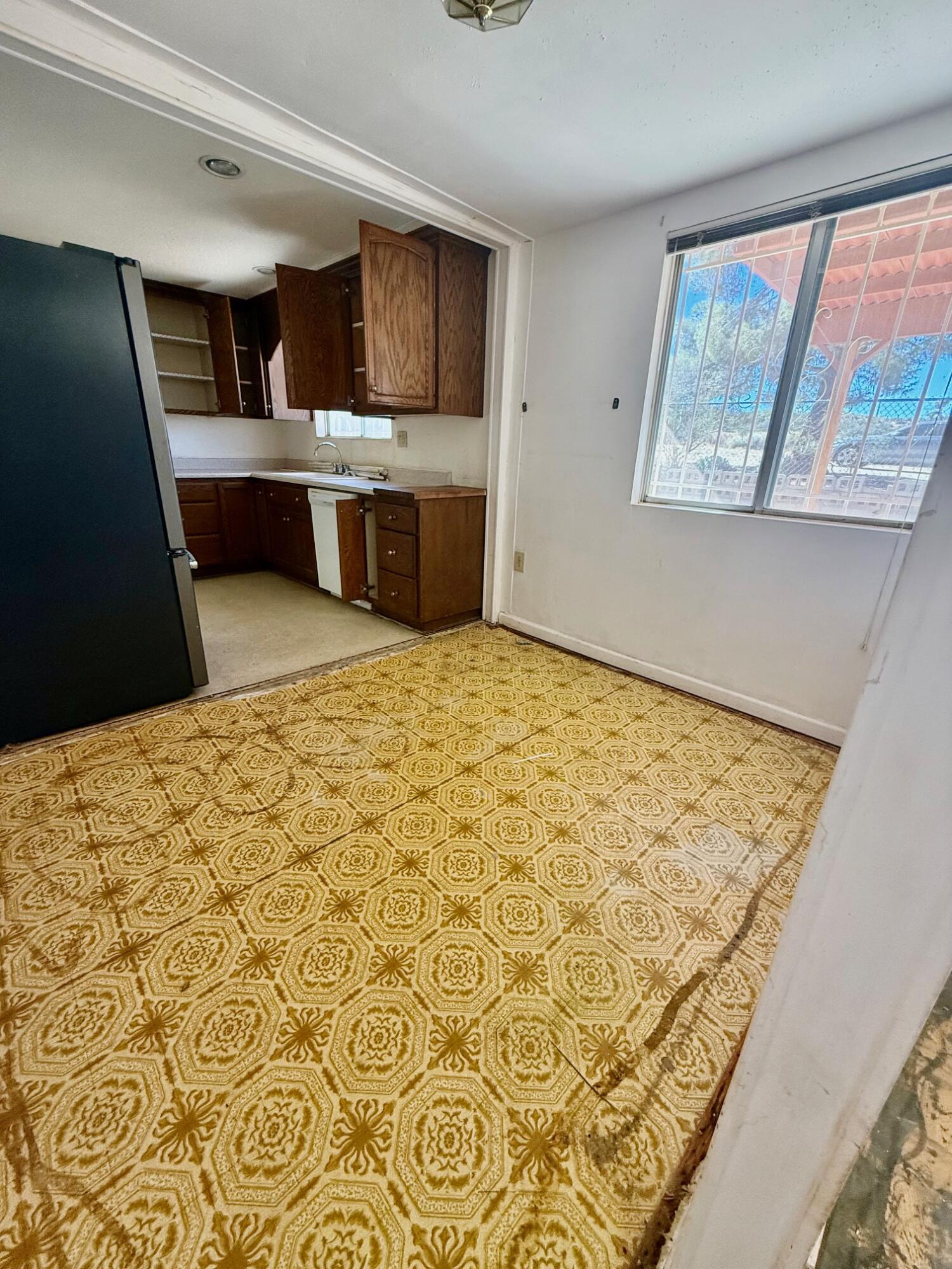 7990 Ramas Avenue Yucca Valley, CA 92284 - Photo 13 of 19 a room with a bed and cabinets