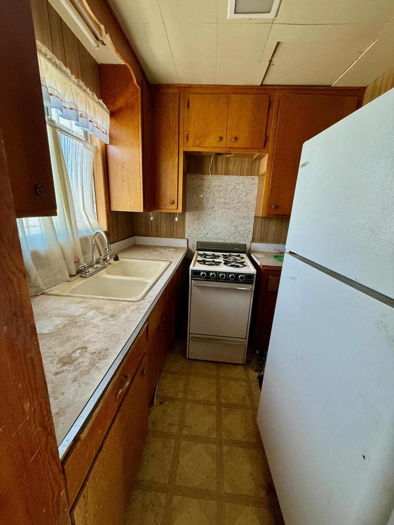 7990 Ramas Avenue Yucca Valley, CA 92284 - Photo 4 of 19 a bathroom with a granite countertop sink and a mirror