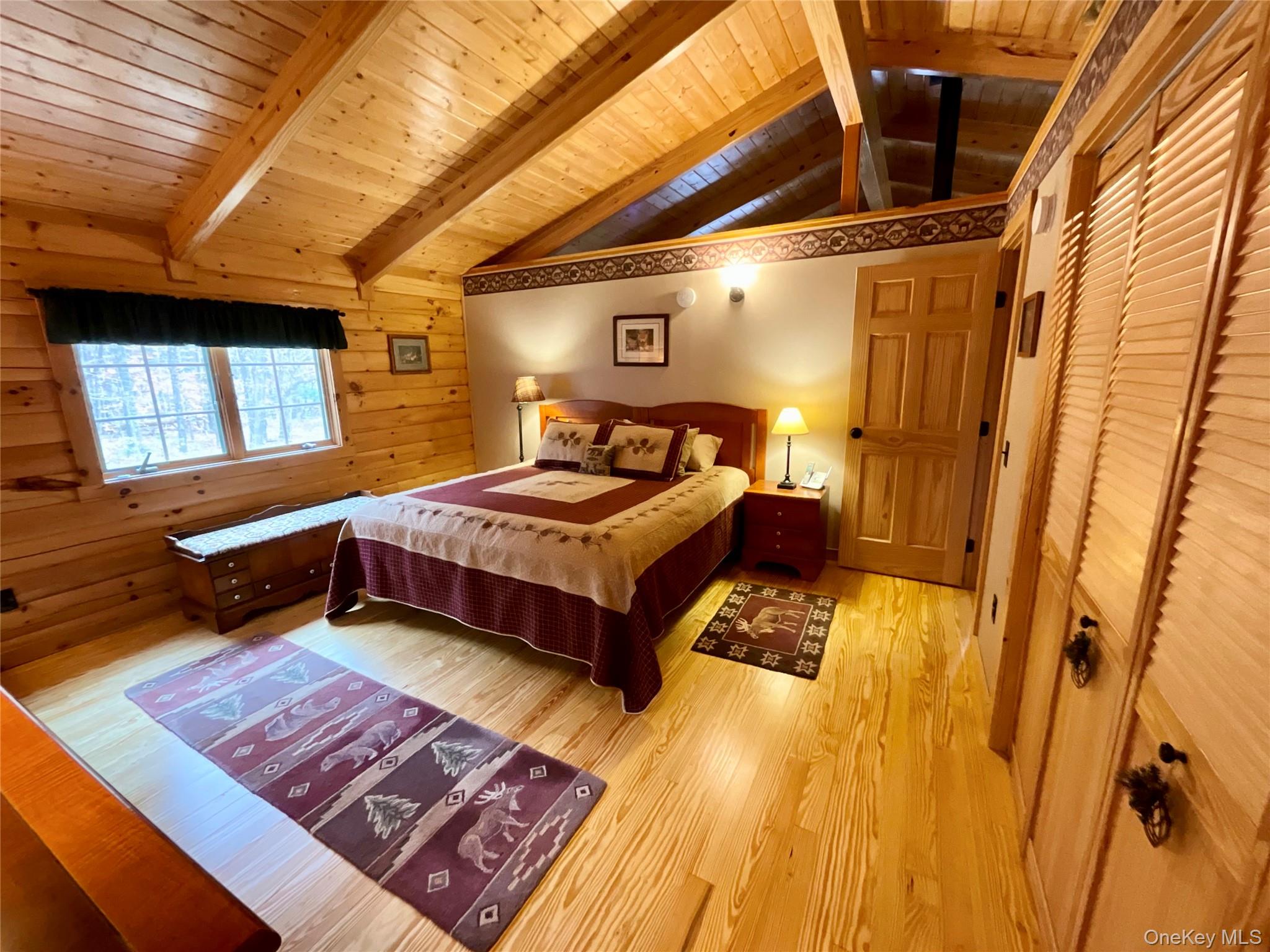 66 Milton Smith Road Long Eddy, NY 12760 - Photo 13 of 25 The bedroom features vaulted ceilings, warm wood accents and peaceful views.