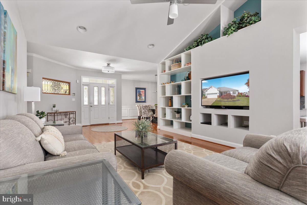 13612 Ryton Ridge Lane Gainesville, VA 20155 - Photo 14 of 83 a living room with furniture and a flat screen tv