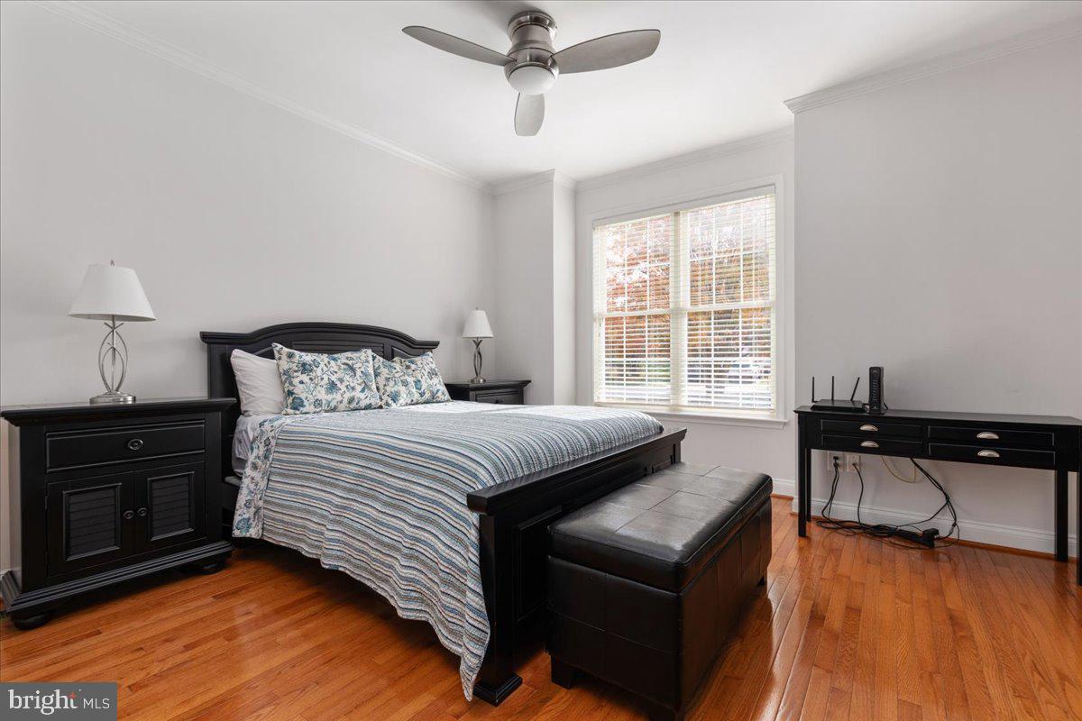 13612 Ryton Ridge Lane Gainesville, VA 20155 - Photo 27 of 83 a bedroom with a bed and wooden floor