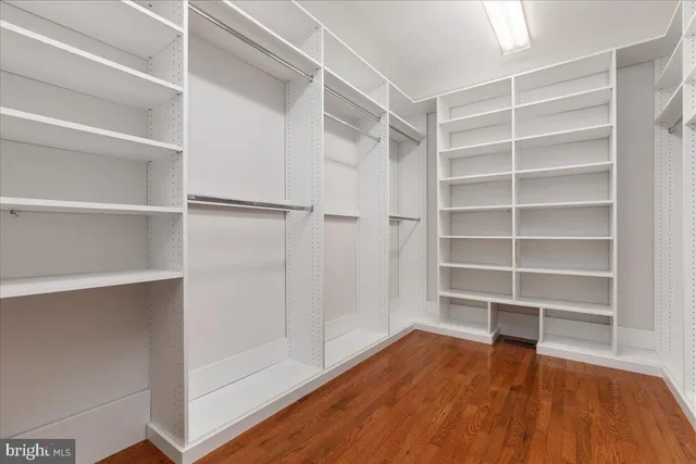 a view of a a dining room with furniture window and wooden floor