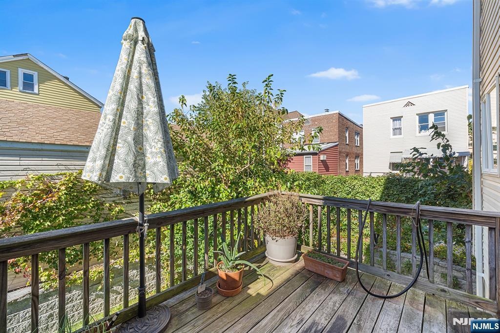 233 5th Street, Unit B Fairview, NJ 07022 - Photo 31 of 31 a view of a wooden chairs on the roof deck