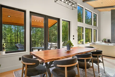 a view of a dining room with furniture window and outside view