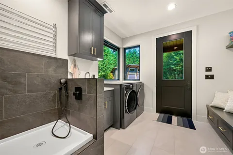 a bathroom with a sink a toilet and a shower