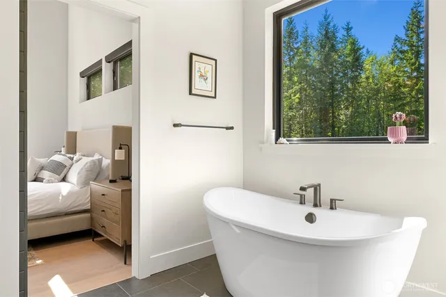 a bathroom with a sink and a window