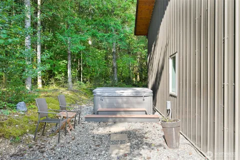 a view of a backyard with sitting area