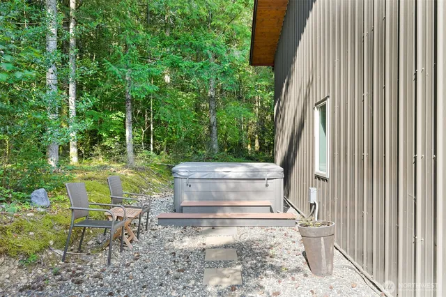 a view of a backyard with sitting area