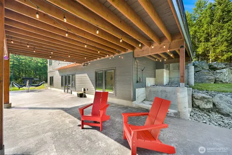 a building outdoor space with patio furniture and potted plants