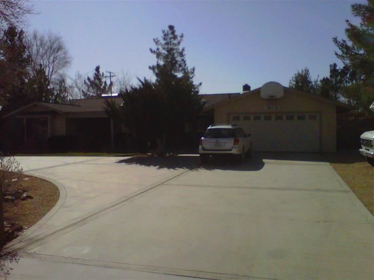 18735 Seneca Road Apple Valley, CA 92307 - Photo 1 of 1 a car parked on the side of the road