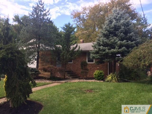 6 Gurley Road Edison, NJ 08817 - Photo 1 of 15 a view of a backyard with potted plants and large trees