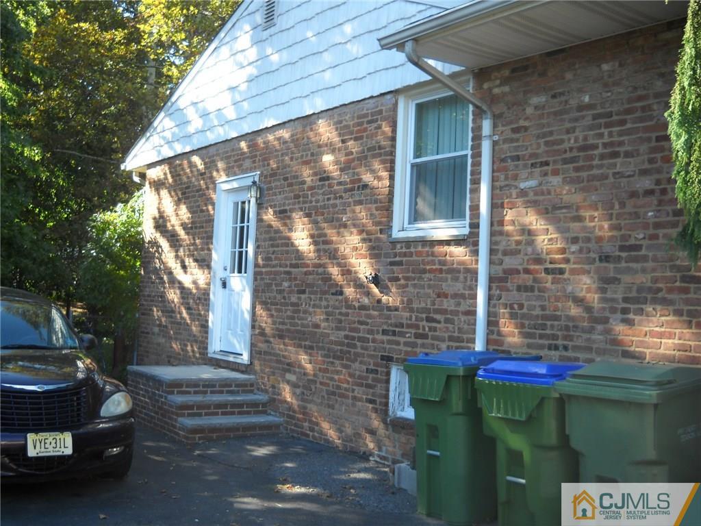 6 Gurley Road Edison, NJ 08817 - Photo 3 of 15 a front view of a house with a yard