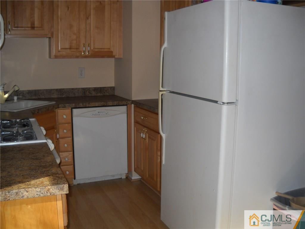 6 Gurley Road Edison, NJ 08817 - Photo 7 of 15 a kitchen with a refrigerator and cabinets