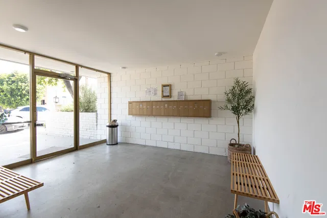 a view of livingroom with furniture and floor to ceiling window