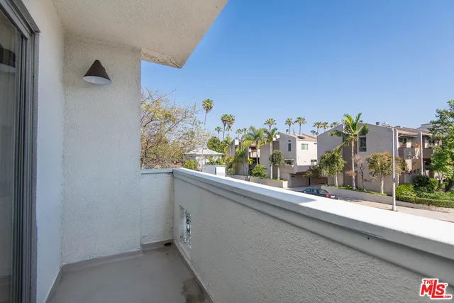 a view of a balcony with city view