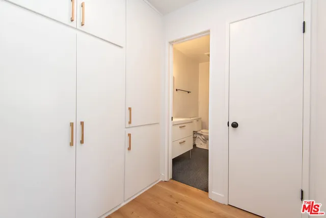 a view of a bathroom from a hallway