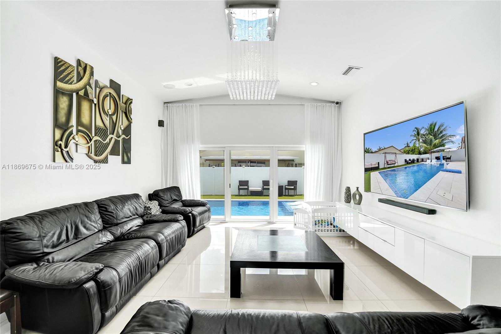 1636 Southwest 108th Terrace Davie, FL 33324 - Photo 29 of 92 a living room with furniture and a flat screen tv