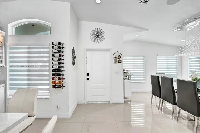 a view of dining room with furniture and window