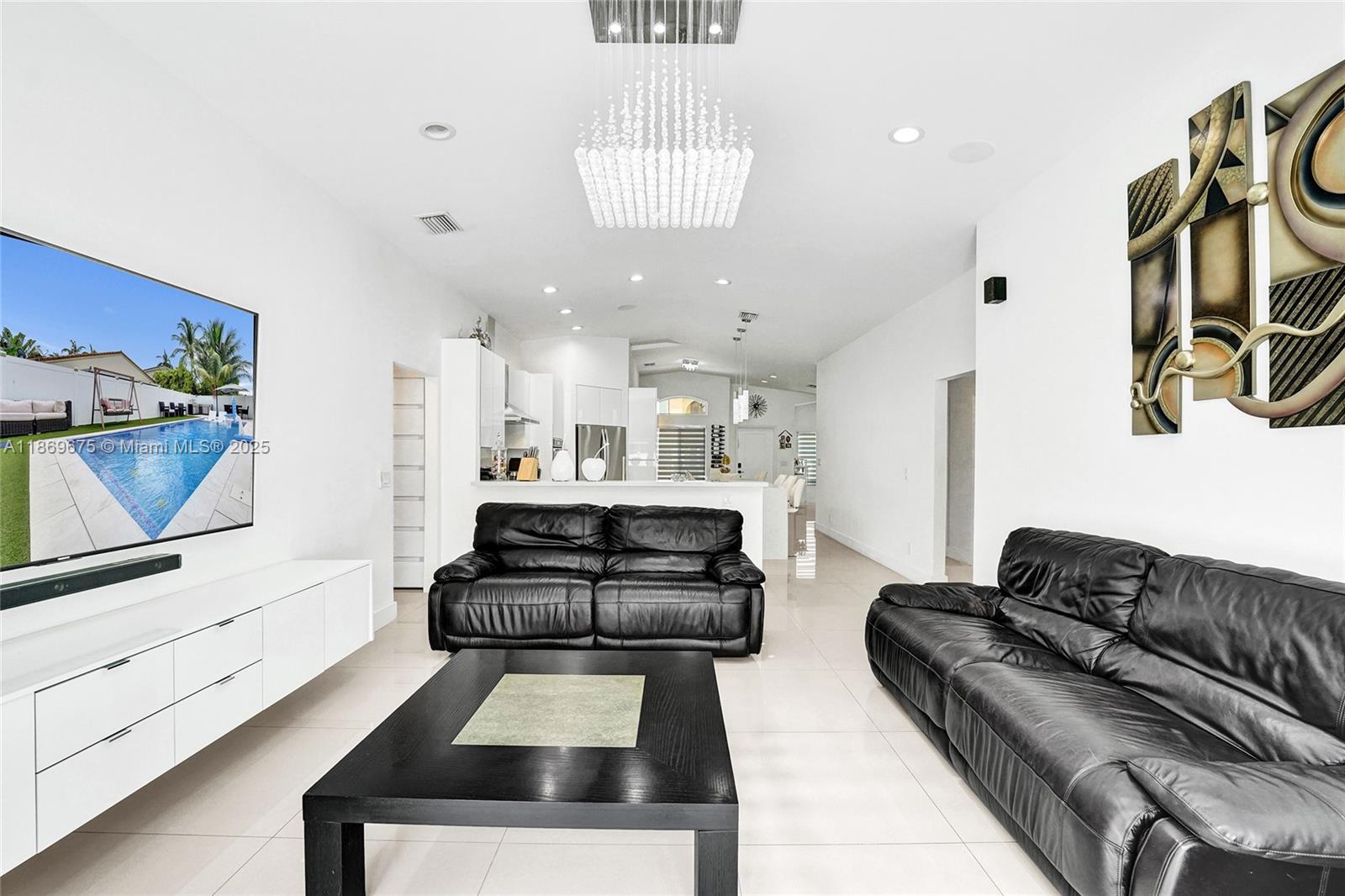 1636 Southwest 108th Terrace Davie, FL 33324 - Photo 33 of 92 a living room with furniture and a flat screen tv