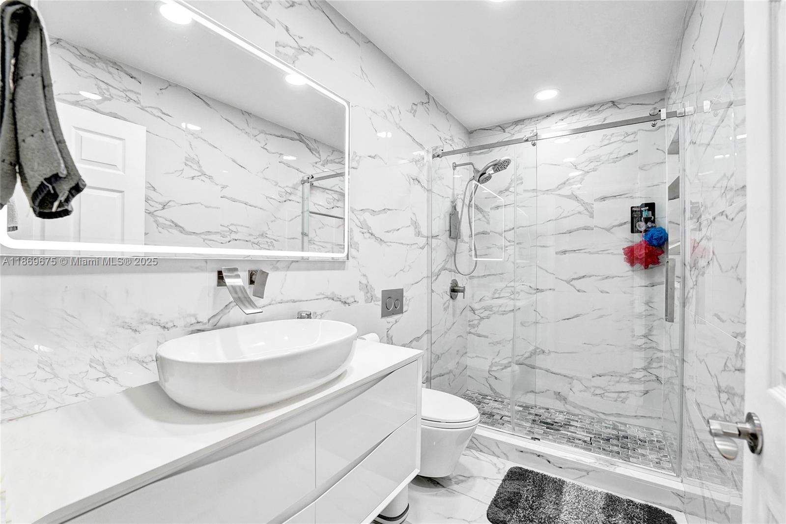 1636 Southwest 108th Terrace Davie, FL 33324 - Photo 35 of 92 a bathroom with a sink a toilet and shower