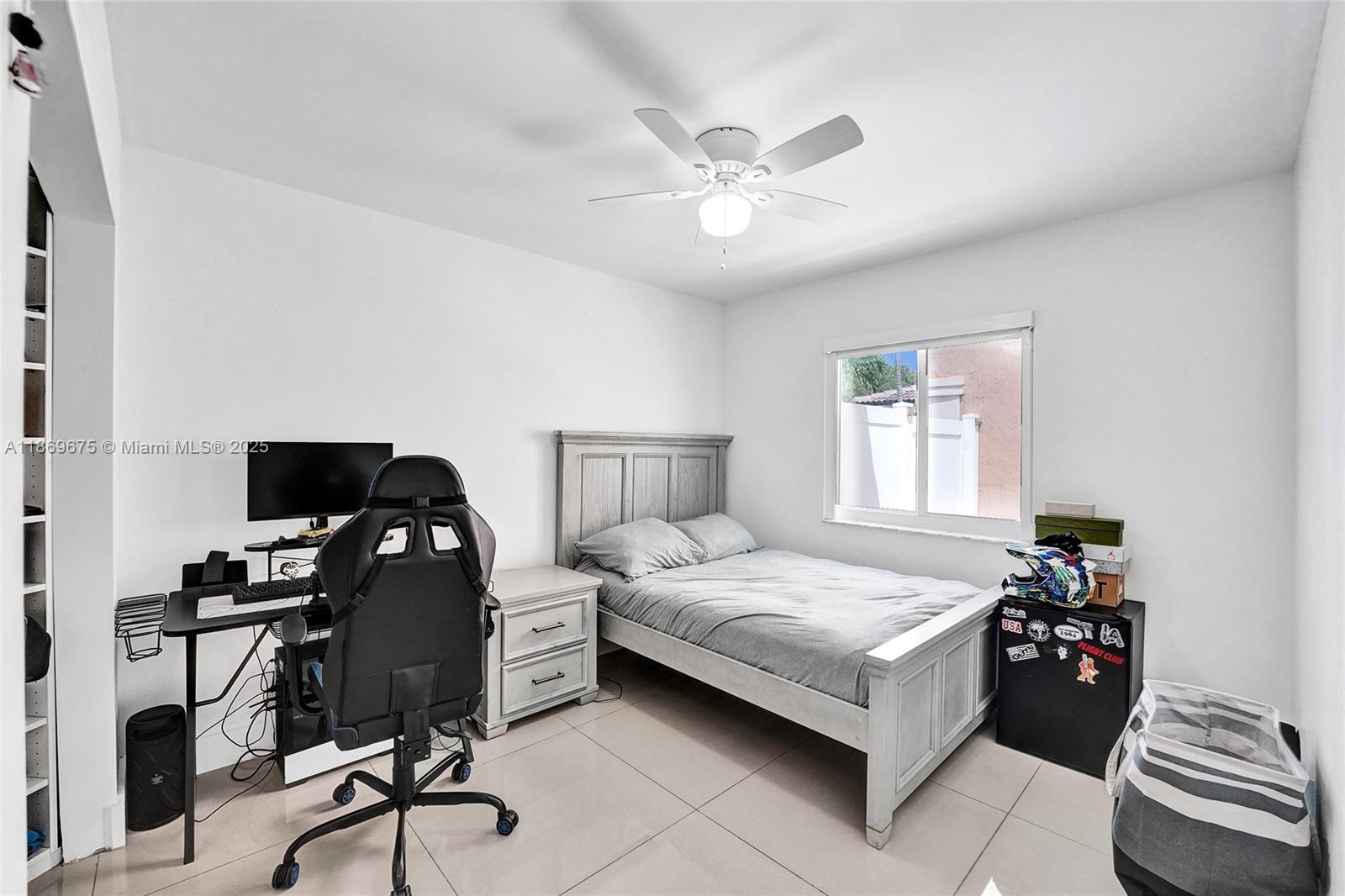 1636 Southwest 108th Terrace Davie, FL 33324 - Photo 38 of 92 a bedroom with a bed and a chandelier