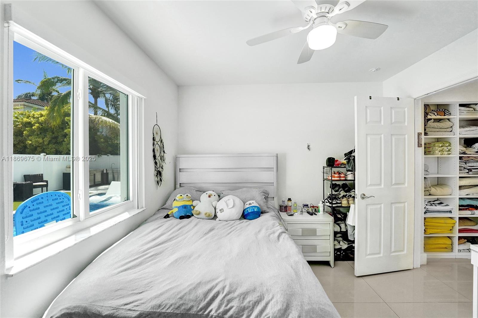 1636 Southwest 108th Terrace Davie, FL 33324 - Photo 50 of 92 a bedroom with a bed and a large closet