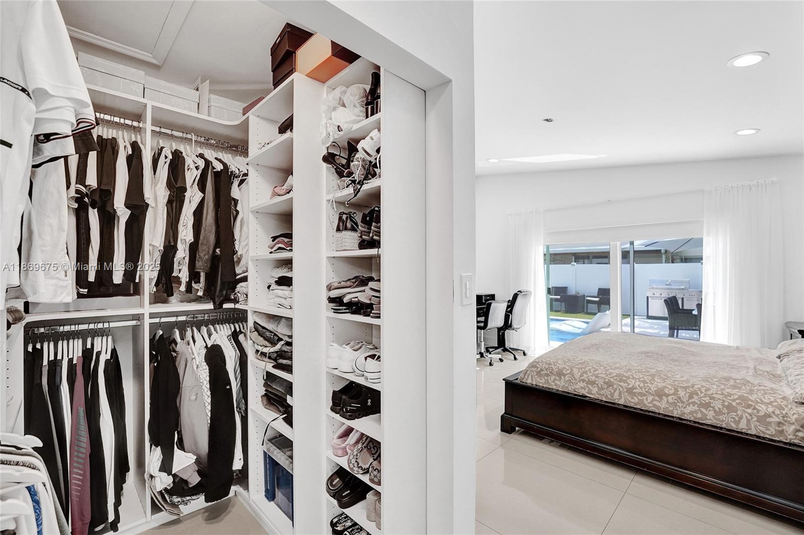 1636 Southwest 108th Terrace Davie, FL 33324 - Photo 58 of 92 a bedroom with a bed and a walk in closet