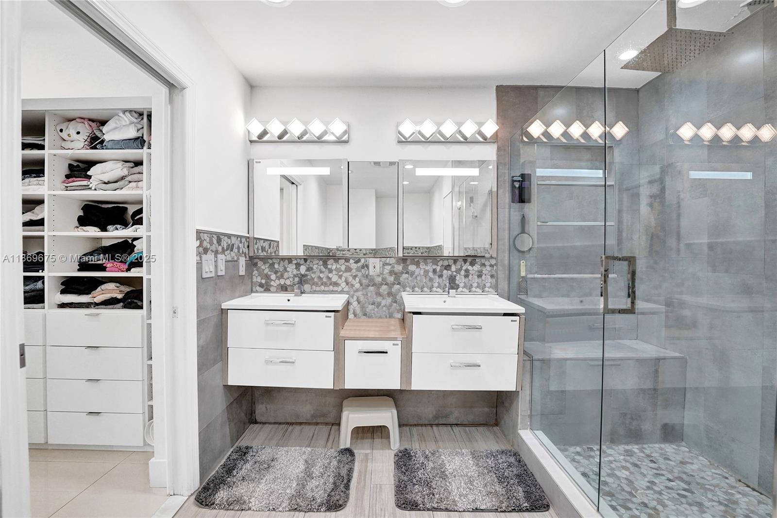 1636 Southwest 108th Terrace Davie, FL 33324 - Photo 60 of 92 a bathroom with a sink double vanity and a mirror