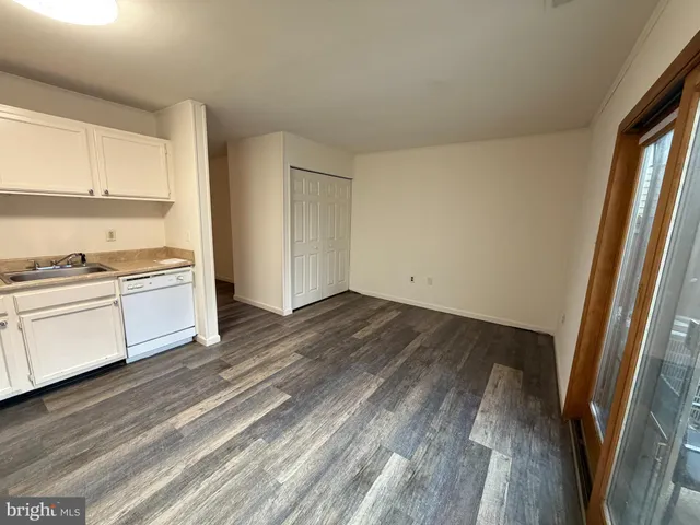 a view of kitchen and wooden floor