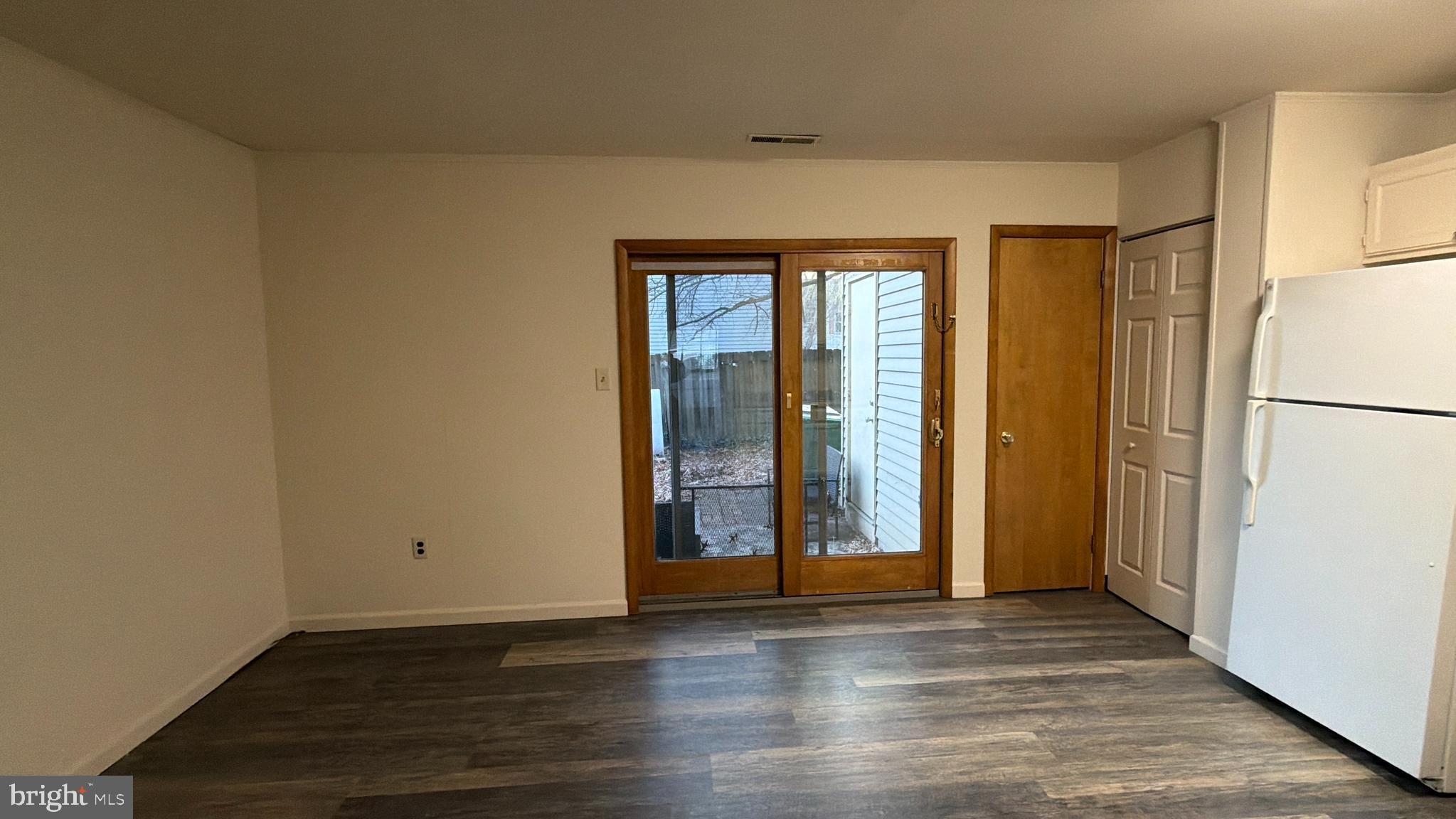 548 Lopax Road Harrisburg, PA 17112 - Photo 17 of 46 a view of an empty room with wooden floor and a window