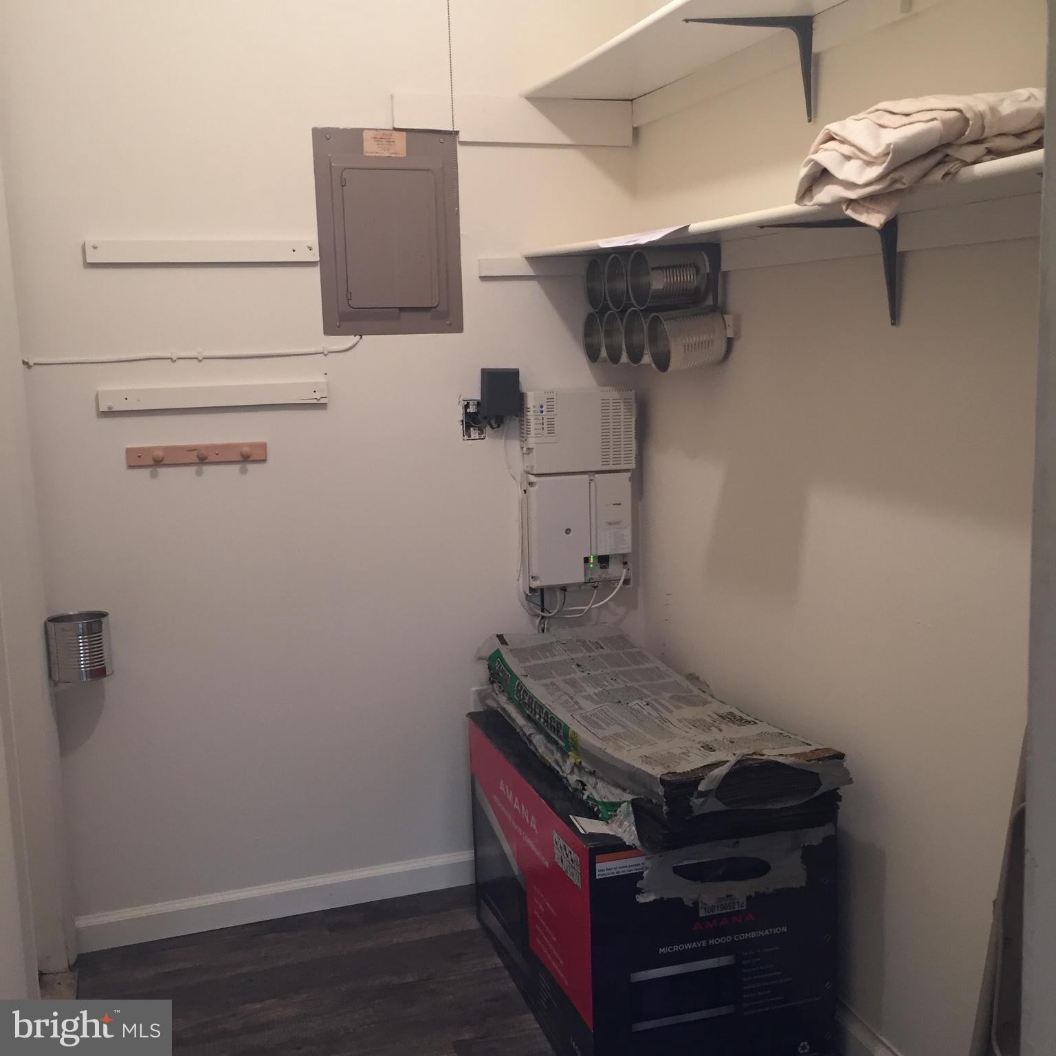 548 Lopax Road Harrisburg, PA 17112 - Photo 18 of 46 a view of storage and utility room with racks on the wall