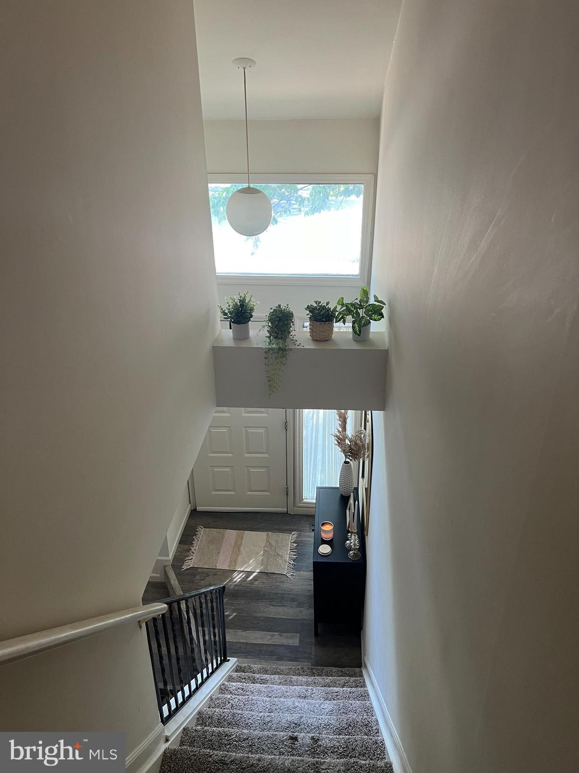 548 Lopax Road Harrisburg, PA 17112 - Photo 30 of 46 a view of a hallway with wooden floor and staircase