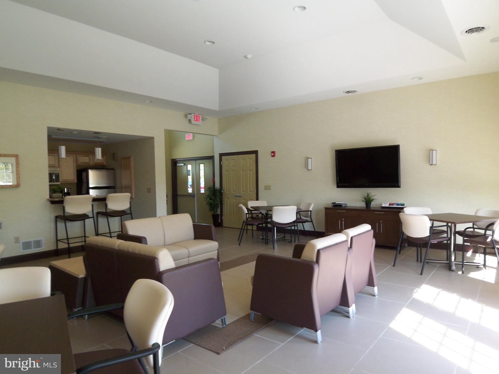 548 Lopax Road Harrisburg, PA 17112 - Photo 44 of 46 a living room with fireplace furniture and a flat screen tv