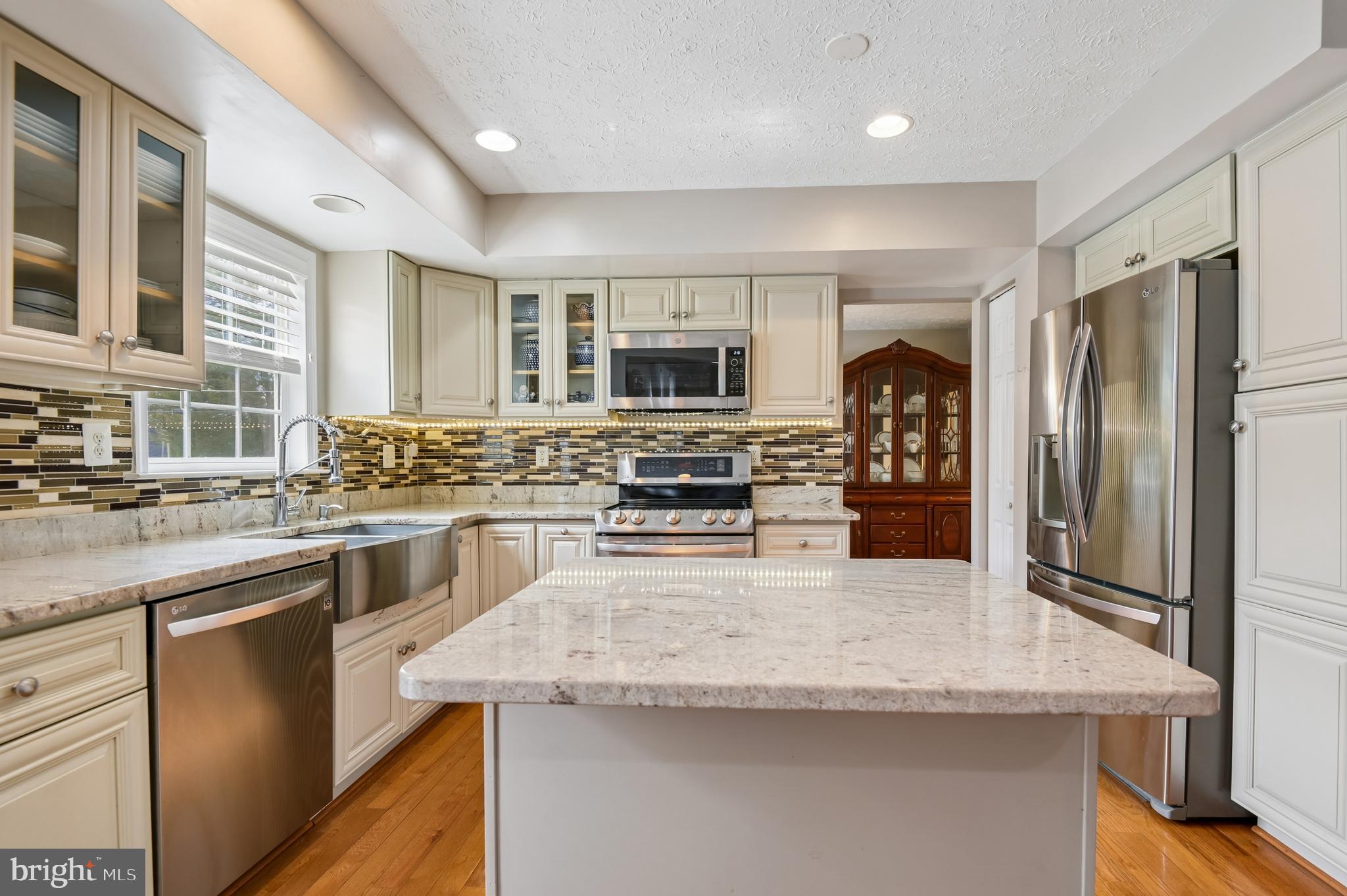 479 Manor Road Aberdeen, MD 21001 - Photo 11 of 36 a kitchen with stainless steel appliances granite countertop a stove refrigerator and a sink