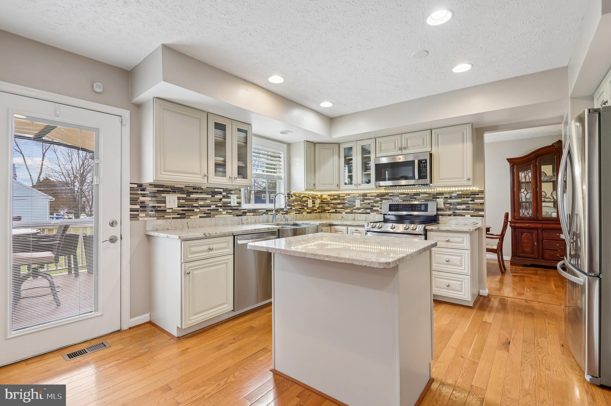 479 Manor Road Aberdeen, MD 21001 - Photo 12 of 36 a kitchen with white cabinets and appliances