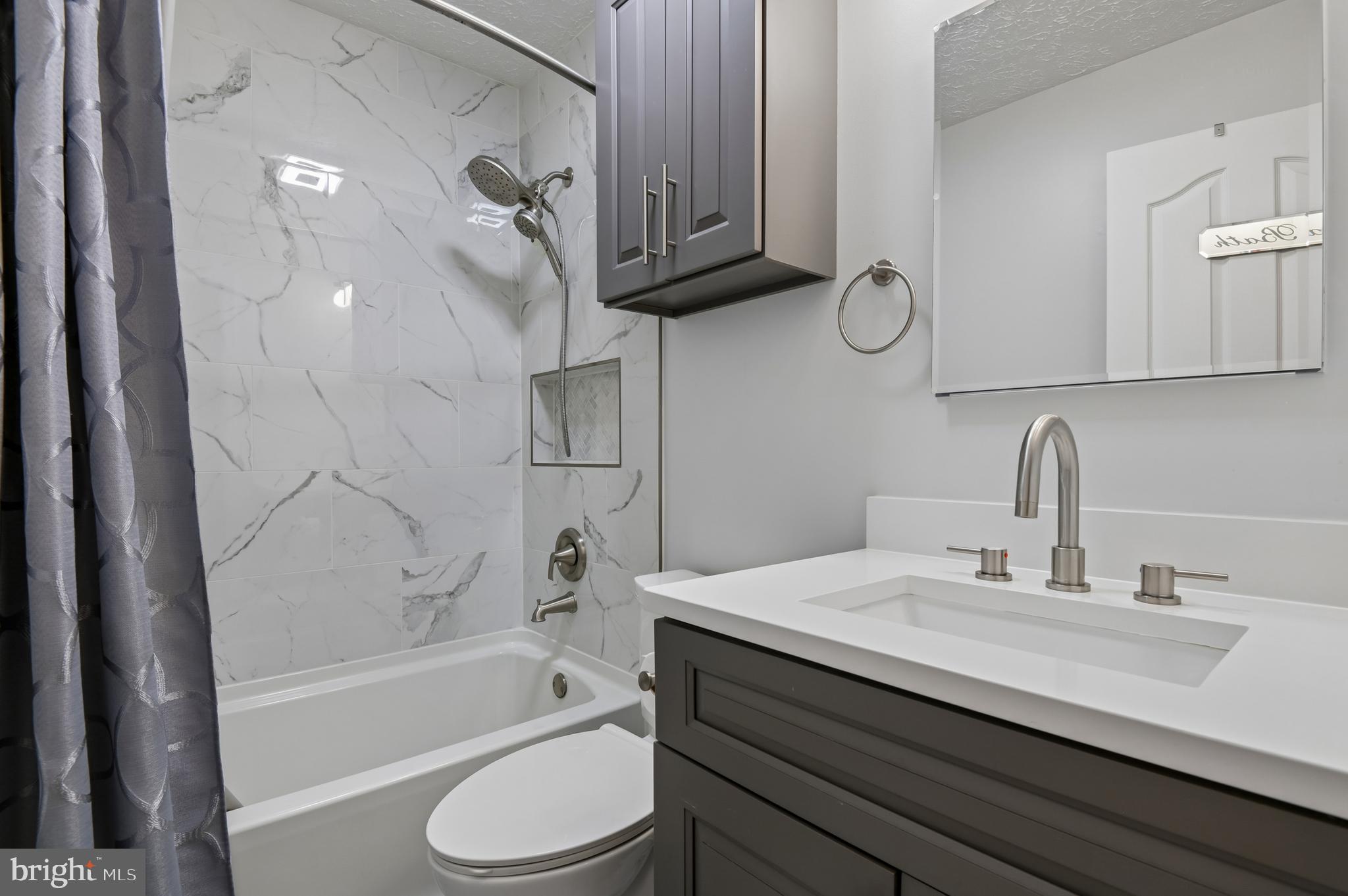 479 Manor Road Aberdeen, MD 21001 - Photo 18 of 36 a bathroom with a sink a toilet and bathtub