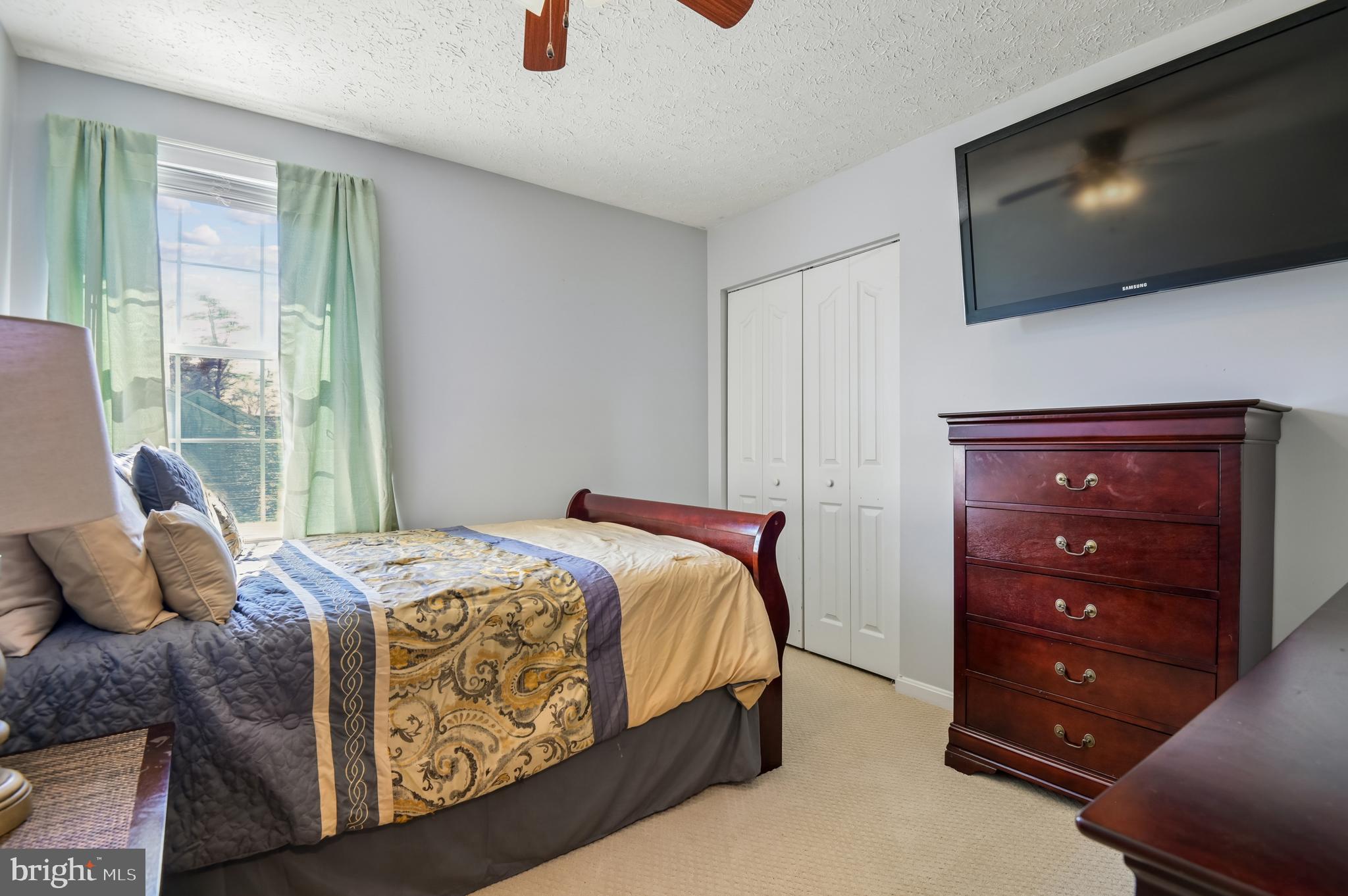 479 Manor Road Aberdeen, MD 21001 - Photo 20 of 36 a bedroom with a bed and a flat screen tv