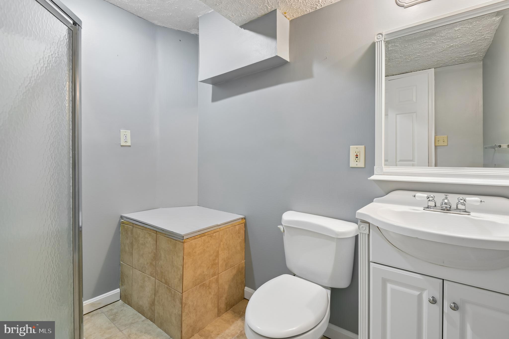 479 Manor Road Aberdeen, MD 21001 - Photo 29 of 36 a bathroom with a toilet sink and mirror