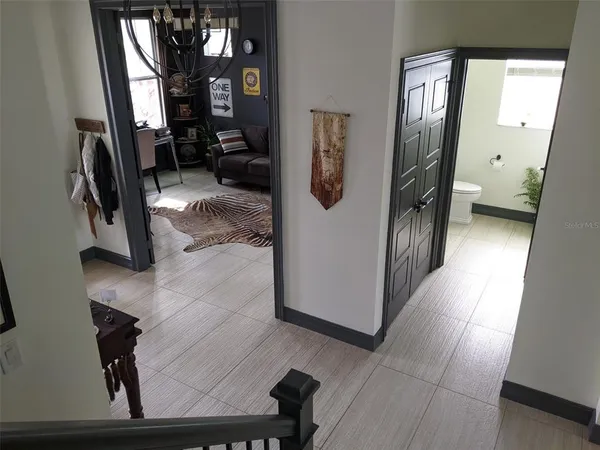 a view of a hallway with seating area