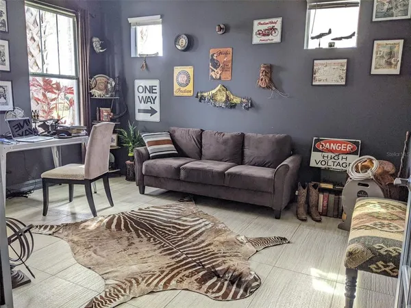 a living room with furniture and a large window