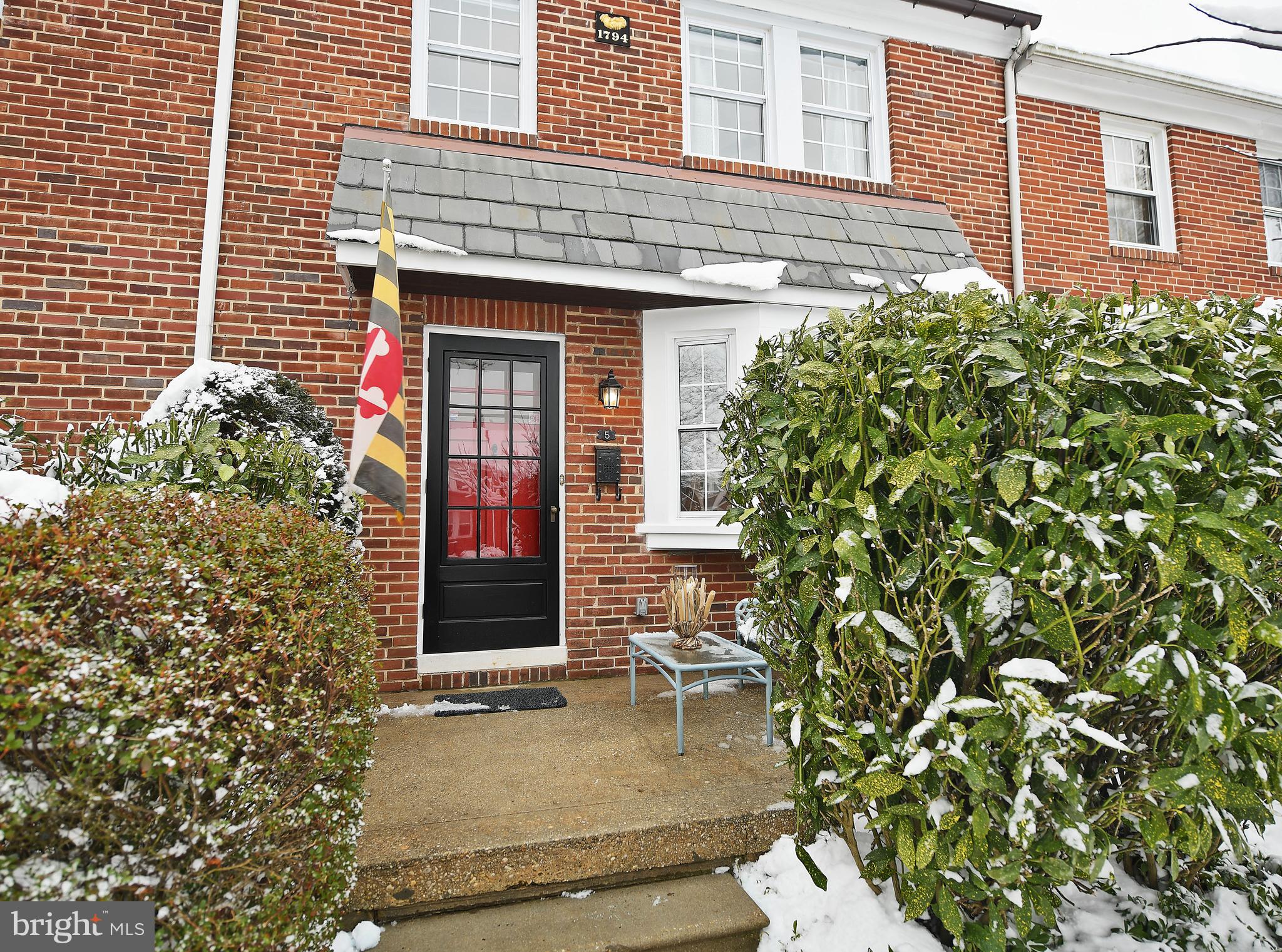 5 Murdock Road Baltimore, MD 21212 - Photo 3 of 48 front view of a brick house with a large windows